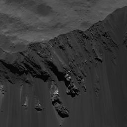 This image of blocks sliding down Occator Crater's southeastern wall on Ceres was obtained by NASA's Dawn spacecraft on June 16, 2018 from an altitude of about 24 miles (39 kilometers).