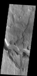 This image from NASA's Mars Odyssey shows a section of an unnamed channel. This channel starts within Claritas Fossae and empties down hill into Icaria Planum.