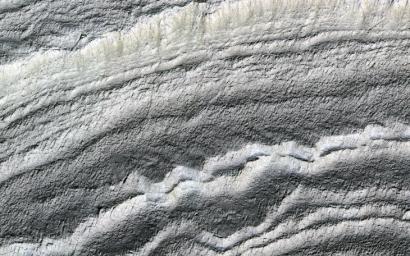 This image acquired on January 21, 2019 by NASA's Mars Reconnaissance Orbiter, shows the south polar layered deposits are well illuminated to accentuate the topography.