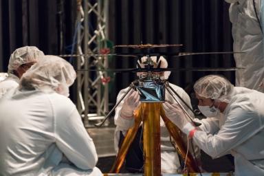 NASA Mars Helicopter team members work the flight model in the Space Simulator at NASA's Jet Propulsion Laboratory in Pasadena, California.