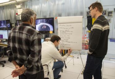 Members from the NASA Mars Helicopter project discuss the sequence of events for the day's flight testing. The image was taken Jan. 18, 2019.