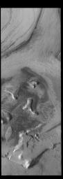 This image from NASA's Mars Odyssey is located near the south polar cap and exhibits the same layering of ice and dust.