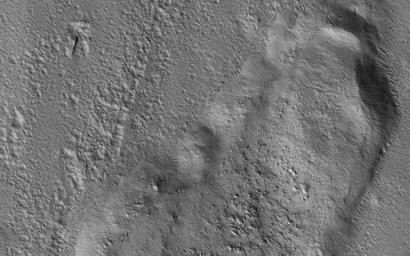 This image acquired on September 24, 2018 by NASA's Mars Reconnaissance Orbiter, shows a huge tongue-like form, which looks a like a mudflow with boulders on its surface.
