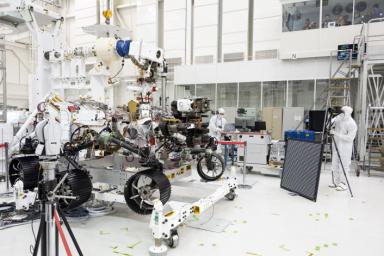 In this image, engineers test cameras on the top of the mast and front chassis of NASA's Perseverance Mars rover.