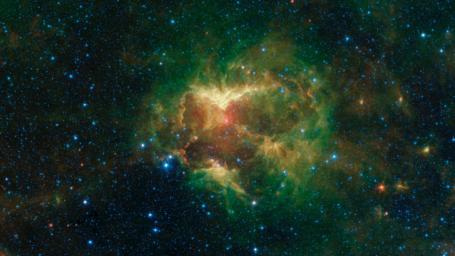 This infrared image from NASA's Spitzer Space telescope shows a cloud of gas and dust carved out by a massive star. A drawing overlaid on the image reveals why researchers nicknamed this region the Jack-o-lantern Nebula.