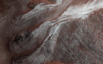 This image, acquired on April 20, 2019 by NASA's Mars Reconnaissance Orbiter, shows bright white flows coming from gullies in a crater wall.