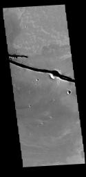 This image from NASA's Mars Odyssey shows linear depressions, graben, that are called Cerberus Fossae.