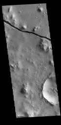 This image from NASA's Mars Odyssey shows a linear depression, part of Cerberus Fossae.