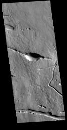 This image from NASA's Mars Odyssey shows a portion of the northern flank of Ascraeus Mons.