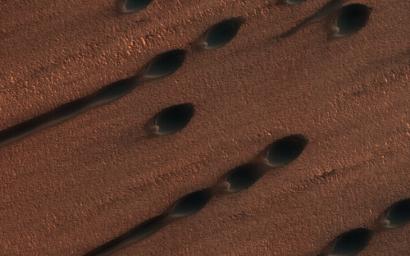 This image, acquired on December 14, 2019 by NASA's Mars Reconnaissance Orbiter, shows shows two types of sand dunes on Mars.