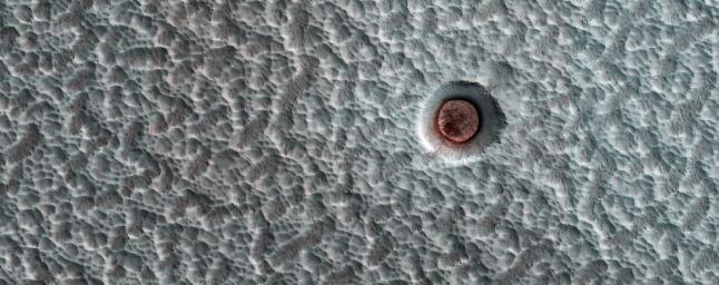 This image, acquired on December 19, 2019 by NASA's Mars Reconnaissance Orbiter, shows an impact crater on the north polar ice cap, which contains an icy deposit on the crater floor.