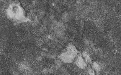 This image, acquired on December 31, 2019 by NASA's Mars Reconnaissance Orbiter, shows four relatively bright mounds along a linear, curving feature that appears to be a rift zone.