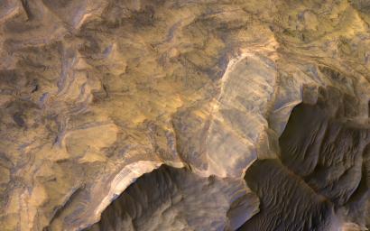 This image, acquired on December 22, 2019 by NASA's Mars Reconnaissance Orbiter, shows Candor Chasma in central Valles Marineris, filled with light-toned layered deposits thought to be sandstones.