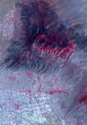 NASA's ASTER instrument imaged areas burned by the Bighorn Fire north of Tucson, Arizona, on June 29. Vegetation is shown in red and burned areas are shown in dark gray.