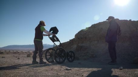 A member of a Mars 2020 science field team operates a subsurface radar in the Nevada desert in February 2020 as part of a practice exercise.