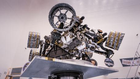 Another view of NASA's Perseverance rover attached to a spin table during a test of its mass properties at the Kennedy Space Center in Florida. The image was taken on April 7, 2020.