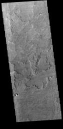 This image from NASA's Mars Odyssey shows a small portion of Daedalia Planum. Daedalia Planum is an immense lava flow field that originates at Arsia Mons.