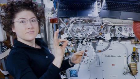 Astronaut Christina Koch assists with a hardware upgrade for NASA's Cold Atom Lab aboard the International Space Station in January 2020.