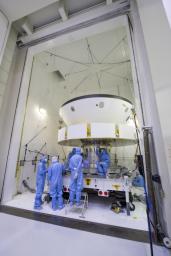 The spacecraft that will carry NASA's Perseverance rover to Mars is examined prior to an acoustic test in the Environmental Test Facility at the Jet Propulsion Laboratory in Southern California.