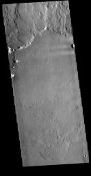 This image from NASA's Mars Odyssey shows the region where flank flows from Olympus Mons meet the surrounding lava plains.