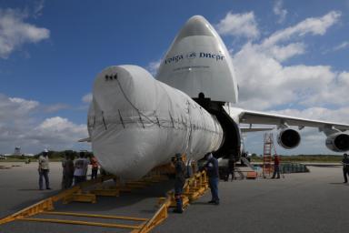 The first stage of the United Launch Alliance Atlas V that will carry NASA's Perseverance rover into space is offloaded from an Antonov cargo plane at Kennedy Space Center in Florida on May 11, 2020.