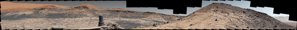 This wide panorama was taken by NASA's Curiosity Mars rover on Dec. 19, 2019. On the righthand foreground is Western Butte. The ridge with a crusty cap in the background is the Greenheugh pediment.