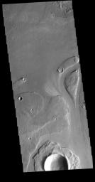 This image from NASA's Mars Odyssey shows part of Athabasca Valles. Several streamlined islands are visible, with tails pointing downstream.