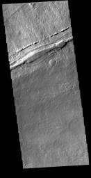 This image from NASA's Mars Odyssey shows the contact of the southern flank of Ascraeus Mons and the surrounding Tharsis region lava flows.