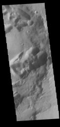 This image from NASA's Mars Odyssey shows the intersection of Mangala Fossae and an impact crater.