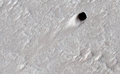 This image acquired on August 16, 2020 by NASA's Mars Reconnaissance Orbiter, shows the ceiling of a lava tube has collapsed in one spot and made this pit crater.