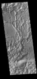 This image from NASA's Mars Odyssey shows a region of chaos where the isolated mesas are still very large, as well as other locations that are already reduced by erosion into small mesas.