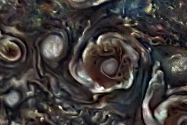 This JunoCam image from NASA's Juno mission depicts one of the eight circumpolar cyclones that surround a central cyclone at the gas giant's north pole.