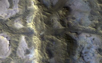 This image acquired on October 12, 2020 by NASA's Mars Reconnaissance Orbiter, shows an isolated, elongated mound (about 1 mile wide and 3.75 miles long) rising above the smooth, surrounding plains.
