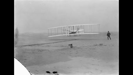 Orville Wright makes the first powered, controlled flight on Earth on December 17, 1903. Material covering the wing of the aircraft was flown to Mars aboard NASA's Ingenuity Mars Helicopter.