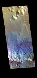 This image from NASA's Mars Odyssey shows the floor of an unnamed crater in Tyrrhena Terra. Sand dunes are visible on the crater floor. Dark blue tones indicate basaltic sands.