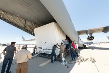 Teams from NASA's Jet Propulsion Laboratory and the March Air Reserve Base loaded the scientific payload for the SWOT Earth-observing satellite into a C-17 airplane on June 27. The hardware is headed to a clean room facility near Cannes, France.