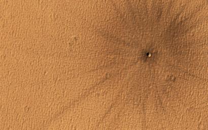 This image acquired on April 10, 2021 by NASA's Mars Reconnaissance Orbiter, shows rays of ejecta thrown out by the impact of a meteor.