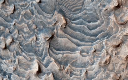 This image acquired on May 4, 2021 by NASA's Mars Reconnaissance Orbiter, shows a layered rock formation within Jiji Crater that has eroded into buttes and stair-like layers.