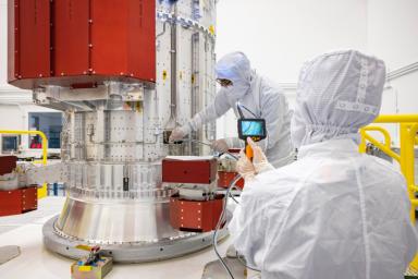 Engineers at the Johns Hopkins Applied Physics Laboratory (APL) in Laurel, Maryland, inspect the propulsion module of NASA's Europa Clipper spacecraft.