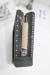 This image shows a core collected from a basaltic rock during a test of the Perseverance rover's Sampling and Caching System at NASA's Jet Propulsion Laboratory in Southern California.