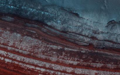 This image acquired on June 21, 2021 by NASA's Mars Reconnaissance Orbiter, shows the North Polar Layered Deposits (NPLD), large layered deposits of dusty water-ice in the northern polar region of Mars.