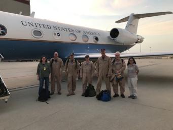 JPL researchers Cathleen Jones and Yunling Lou stand with the flight crew in front of the airplane used to fly the UAVSAR instrument on October 6, 2021.
