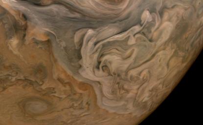 The three-dimensional character of Jupiter's cloud decks is captured in this image, taken by NASA's Juno spacecraft, of the planet's North Equatorial Belt.