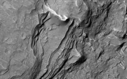 This image acquired on September 4, 2021 by NASA's Mars Reconnaissance Orbiter, shows Orson Welles Crater, north of Ganges Chasma.