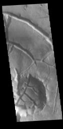 This image from NASA's Mars Odyssey shows part of Aram Chaos. Aram Chaos was initially formed by a large impact.