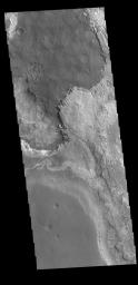This image from NASA's Mars Odyssey shows layering of surface materials in Meridiani Planum.