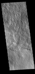 This image from NASA's Mars Odyssey shows part of the flank of Ascraeus Mons. Thin lava flows are visible.