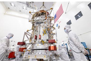 NASA's Europa Clipper spacecraft is visible in a main clean room at JPL, as engineers and technicians inspect it just after delivery in early June 2022.
