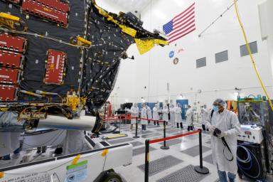 Members of the media view the Psyche spacecraft on April 11, 2022, inside a clean room at JPL. The spacecraft is scheduled to launch in August on a journey to a metal-rich asteroid of the same name.