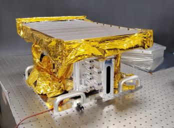The HVM³ instrument sits in a JPL clean room in early December 2022. The instrument was built at JPL then shipped to Lockheed Martin Space in Colorado to be integrated with NASA's Lunar Trailblazer spacecraft.